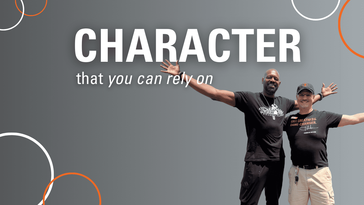 Herman Moore and The Branch Manager for Detroit smiling and celebrating. Caption of "CHARACTER that you can rely on"