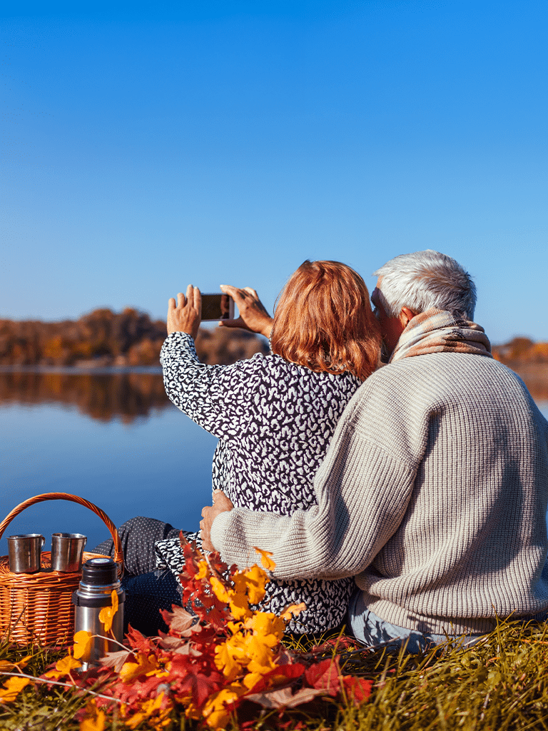 Two happy retirees enjoying their golden years on the lake